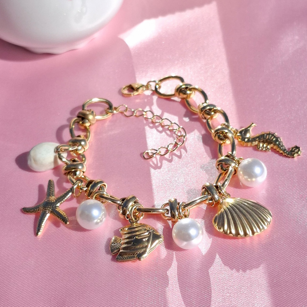 Le Bracelet doré "SORAYA" à breloques